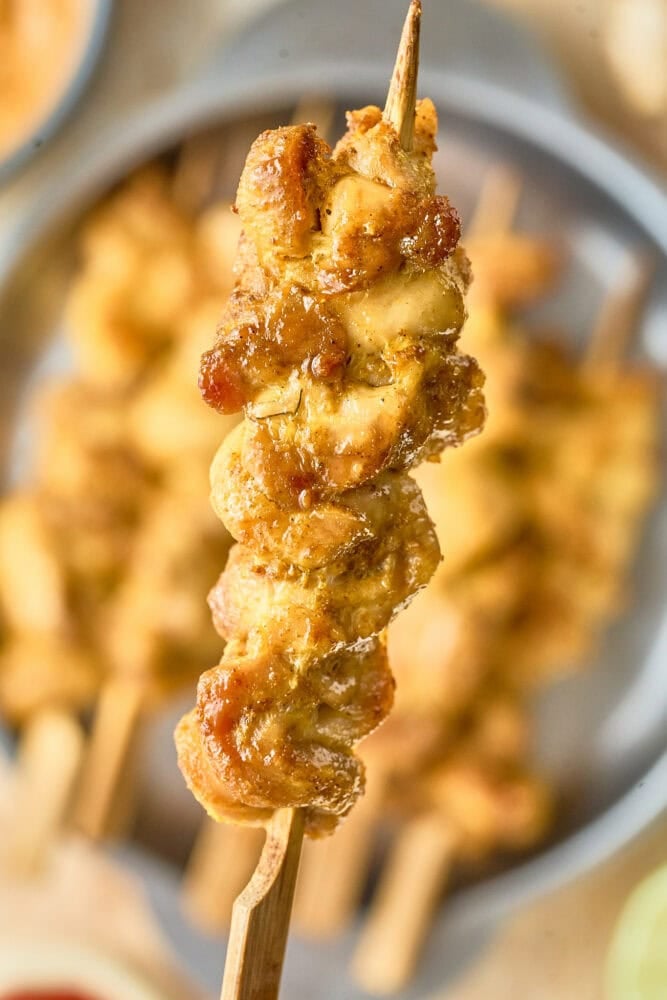 close up of Thai chicken satay on a skewer