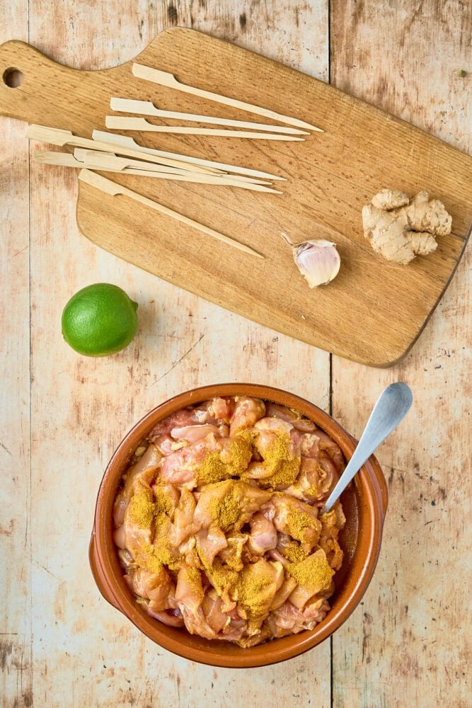 bowl of chicken thighs marinating 