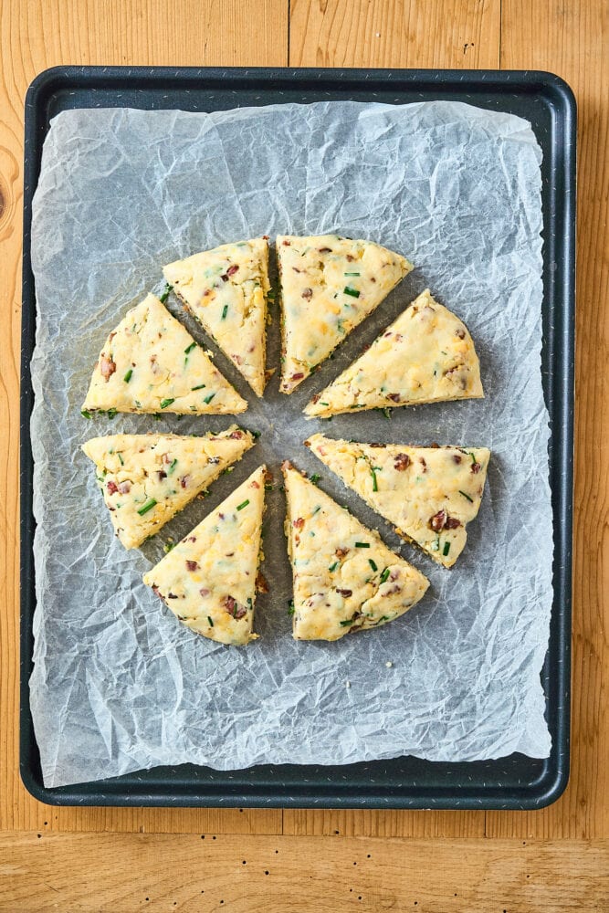 bacon cheddar scones on a baking sheet before baking