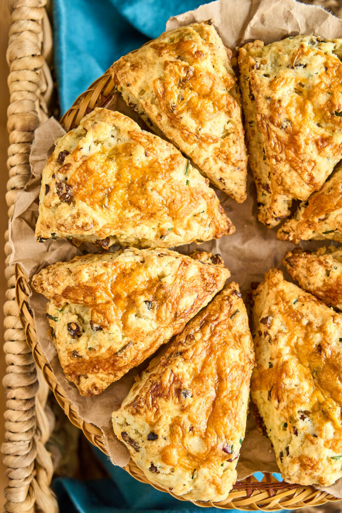 baked bacon cheddar scones in a wicker serving basket