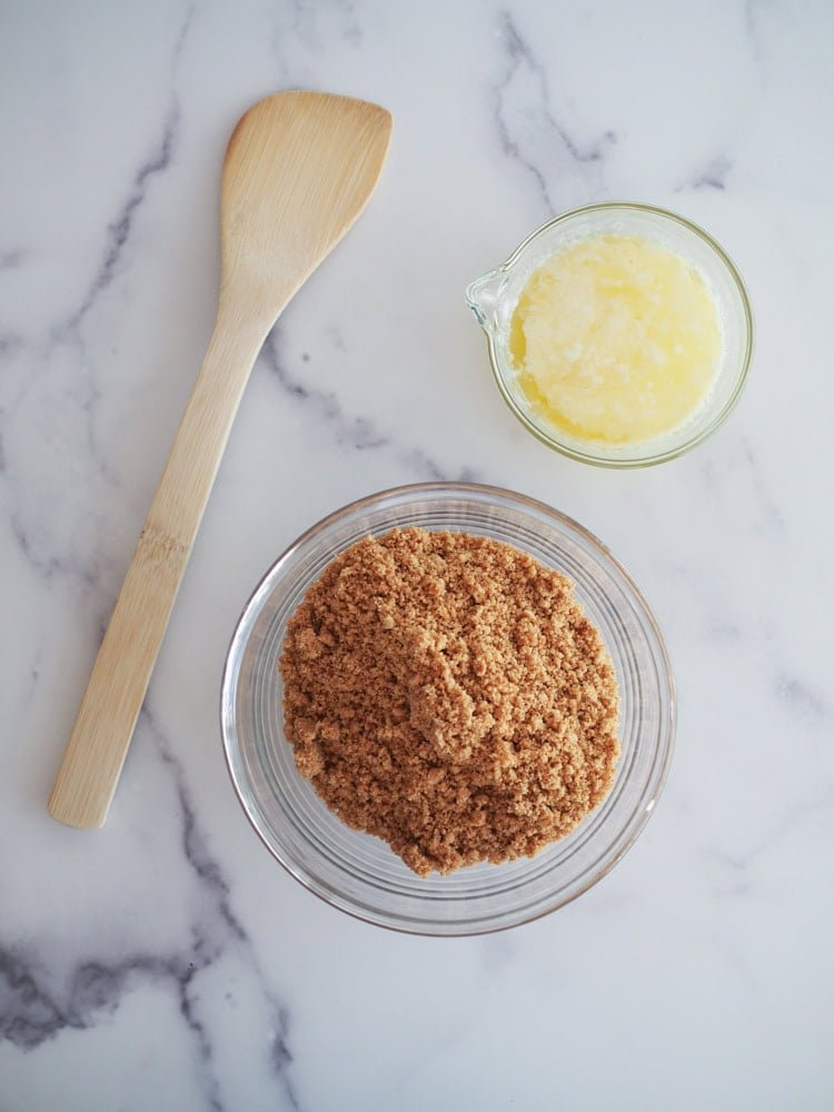 melted butter, stroopwafel crumbs, and bamboo spatula