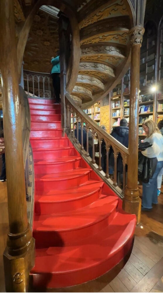 The crimson staircase at Livraria Lello