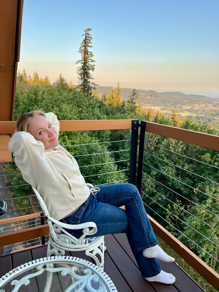 Rachelle on the balcony at their room in Chehalem Ridge Bed and Breakfast