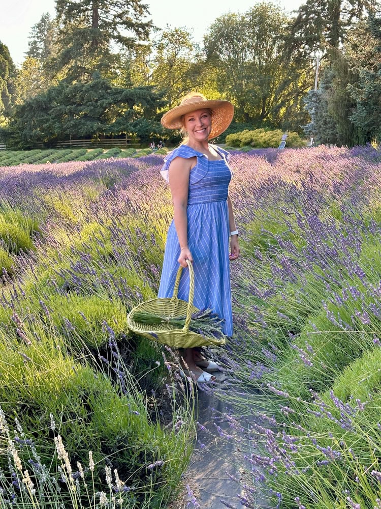 Rachelle standing in lavender fields at Wayward Winds