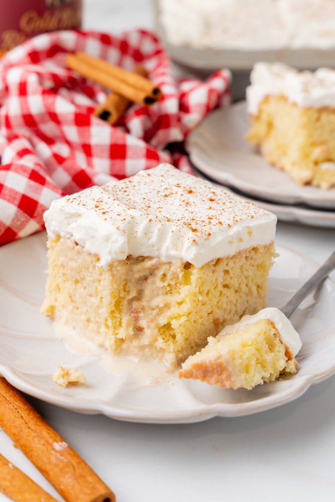 slice of Coquito Tres Leches Cake with bite take out