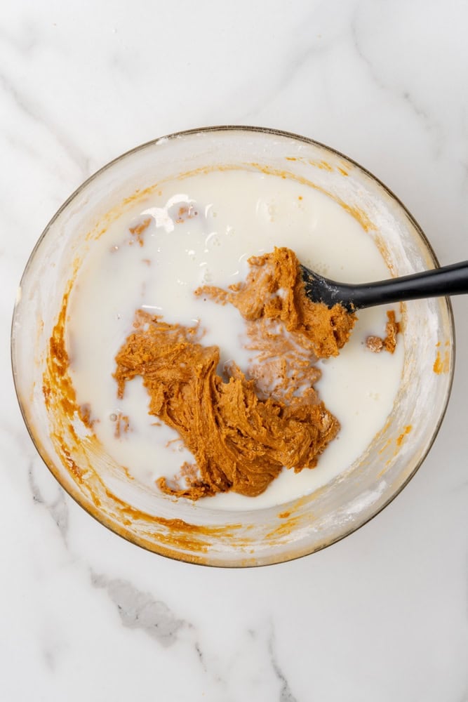 mixing together the final ingredients for gingerbread loaf