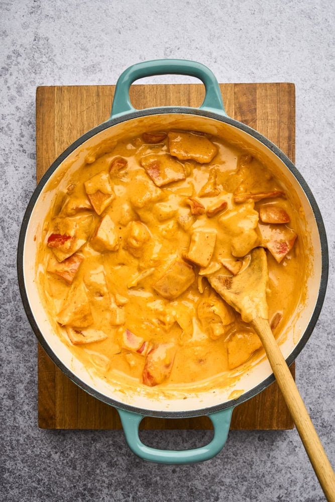 curry in pot on a cutting board