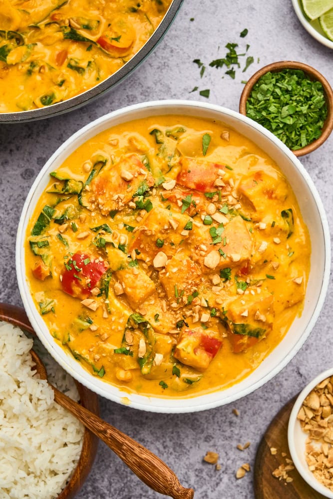 Thai pumpkin curry garnished with peanuts and cilantro