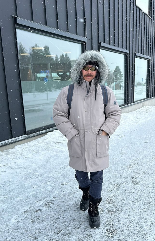 Pete in snow parka and boots for winter packing list