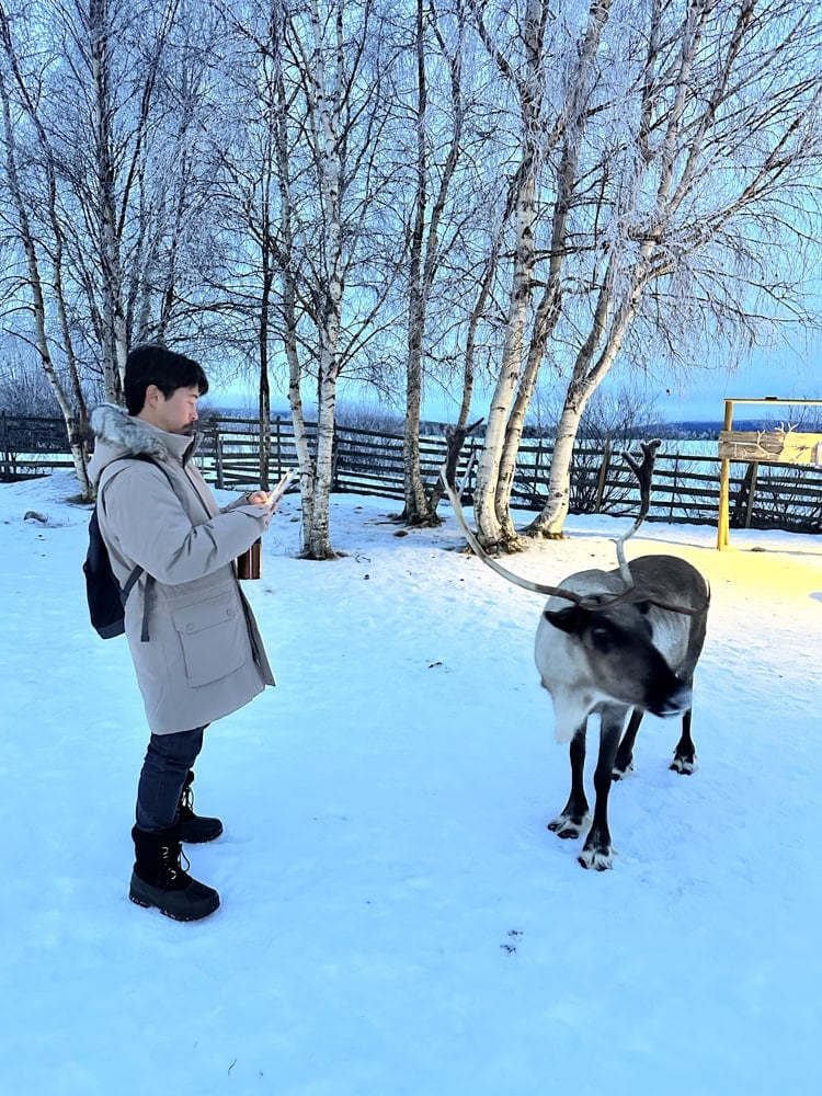 Pete taking a photo of a reindeer
