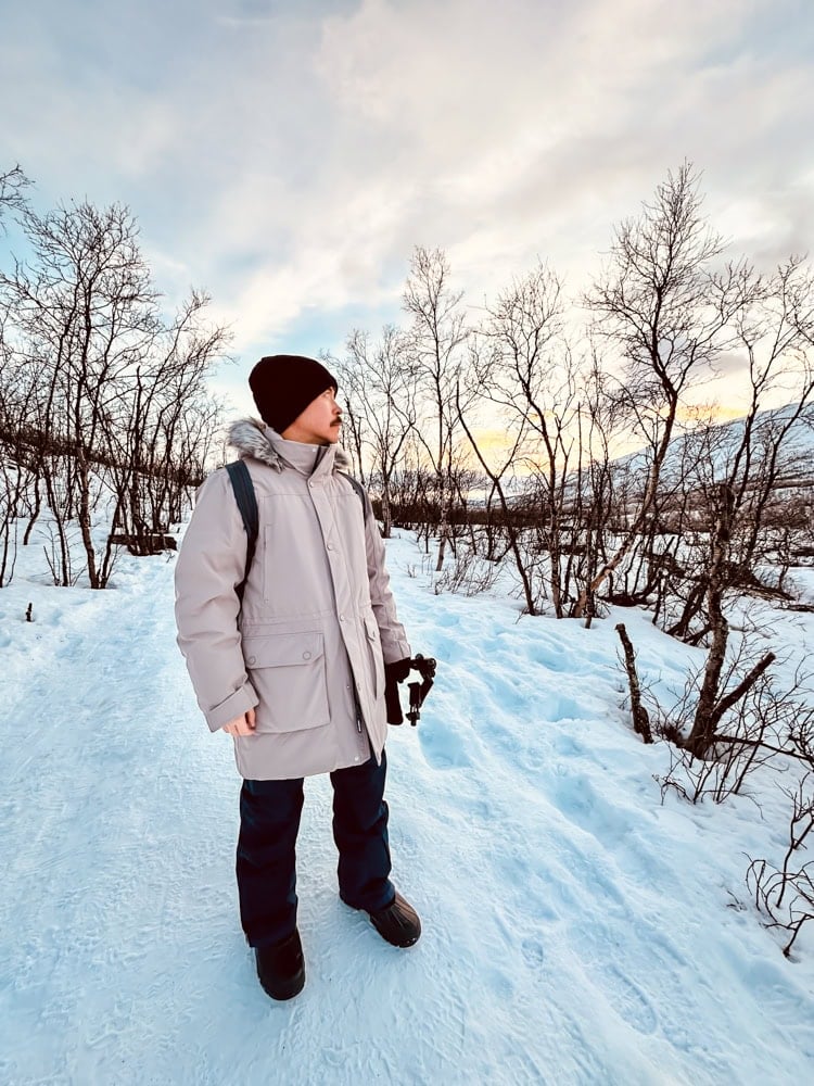 Pete on a snowy nature path in Abisko