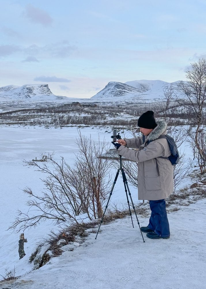 Pete taking photos with an iPhone and tripod