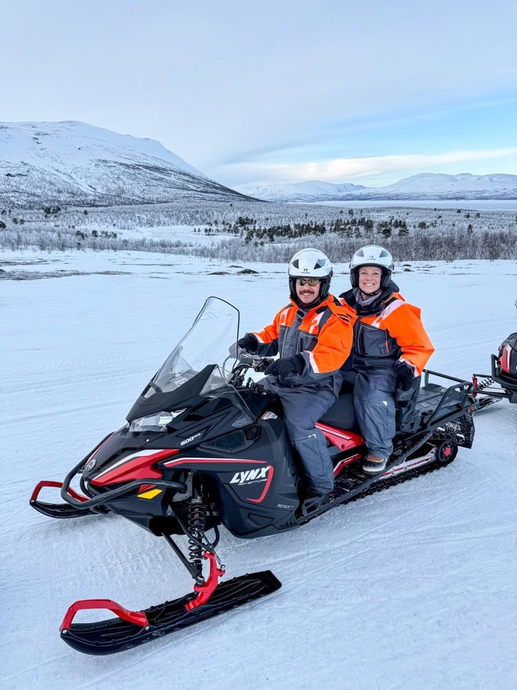 Rachelle and Pete on a snowmobile.