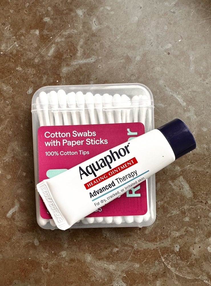 photo of aquaphor and cotton swabs