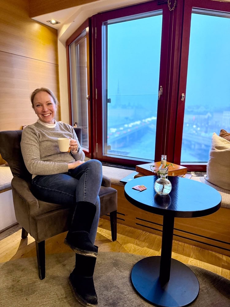 Rachelle having coffee in a Stockholm hotel.