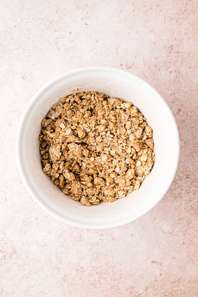 bowl with oats and other ingredients to make pear crisp