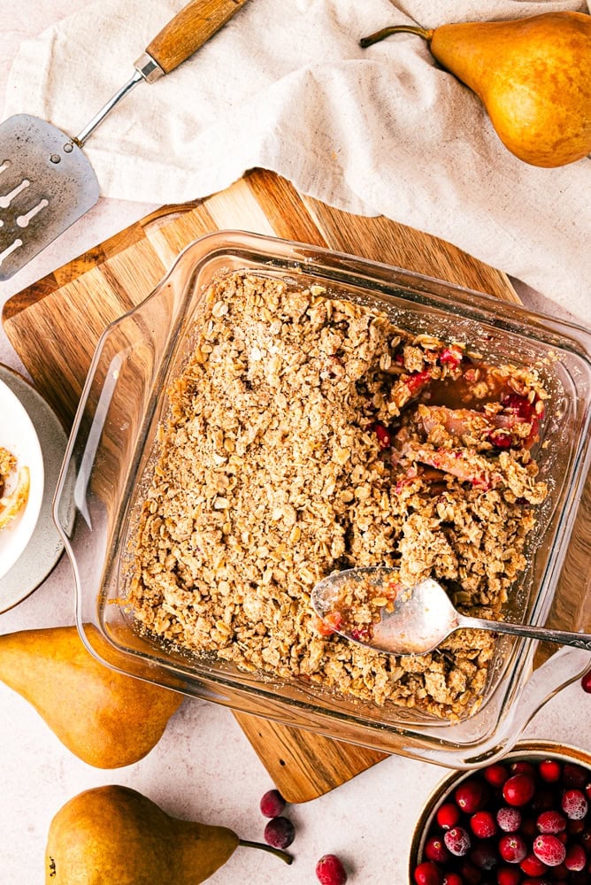 overhead view of pear crisp in a pink glass baking dish