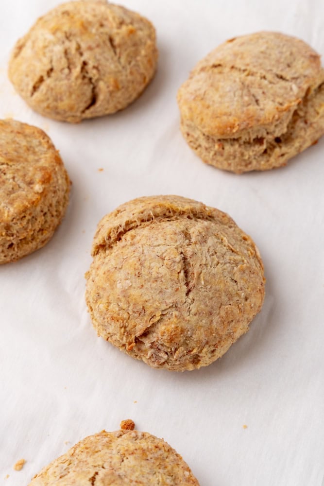 biscuits on white parchment after getting baked