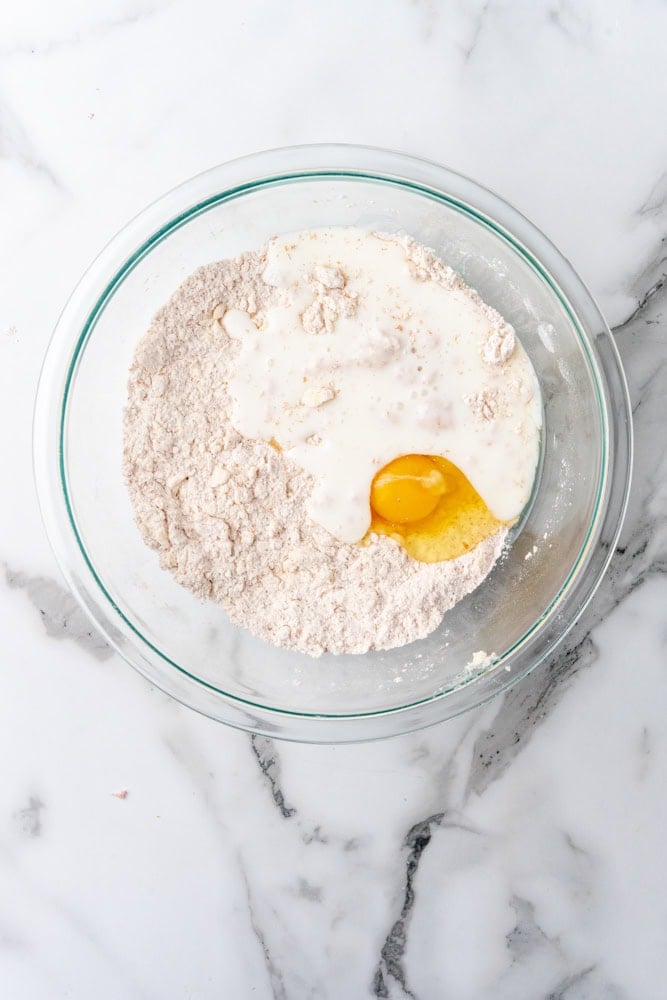 adding egg and buttermilk to flour mixture