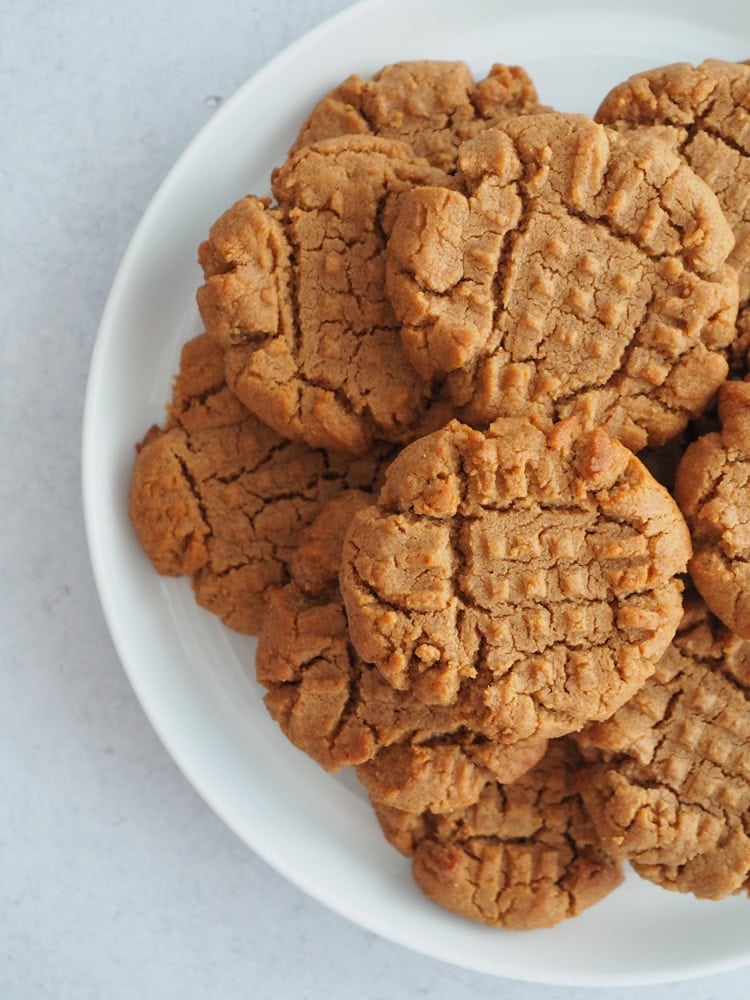 white plate filled with 4 ingredient peanut butter cookies
