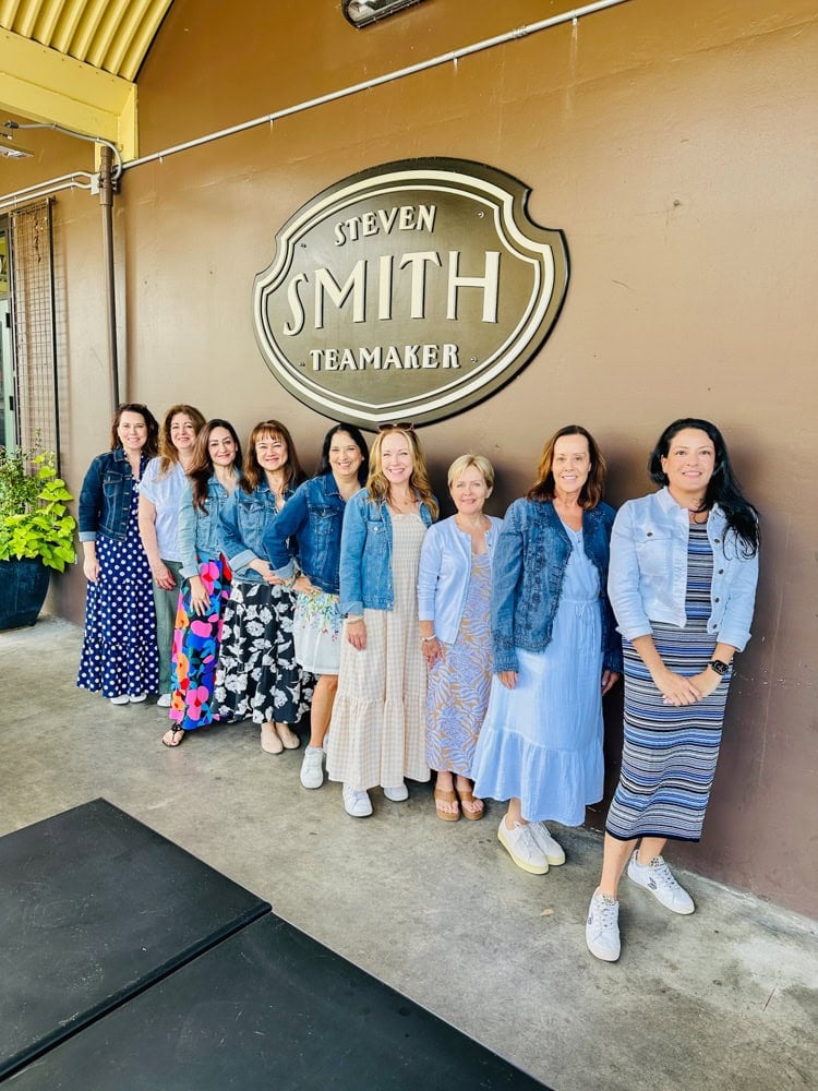 Smith Teamaker: "Tea flight tasting at Smith Teamaker during a Willamette Valley retreat" group of women in front of Steven Smith Teamaker