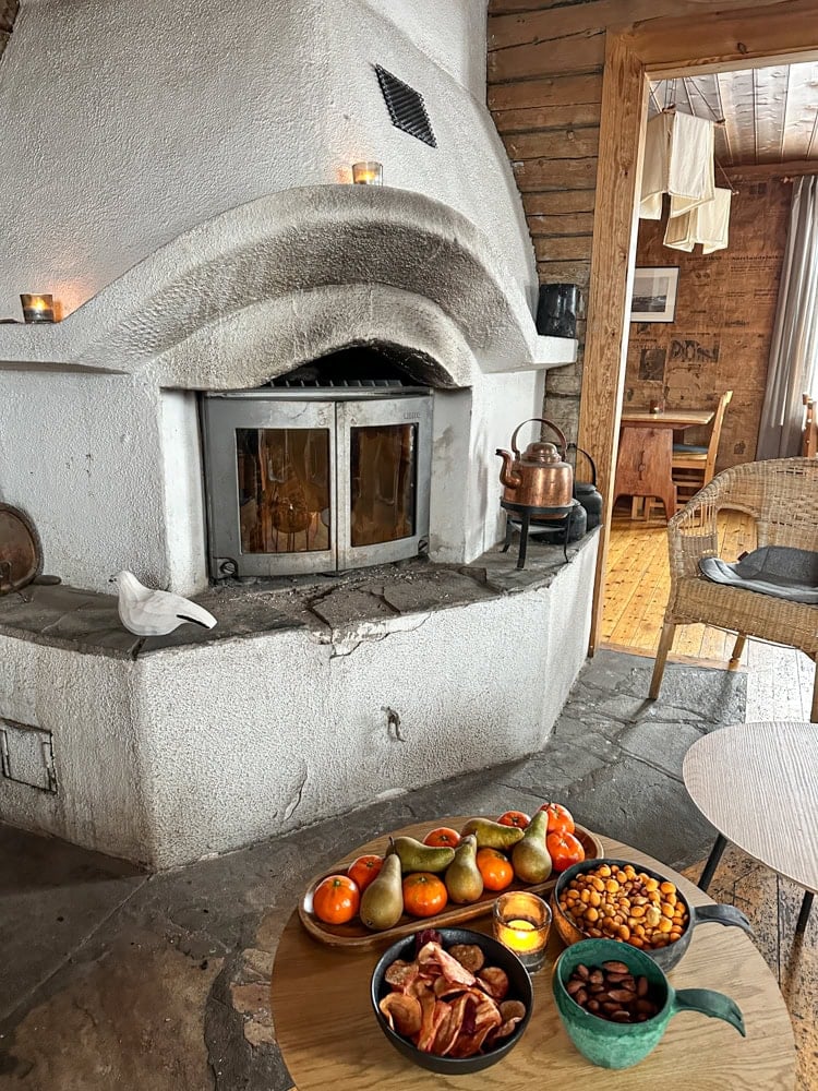 cozy fireplace inside the swedish sauna cottage