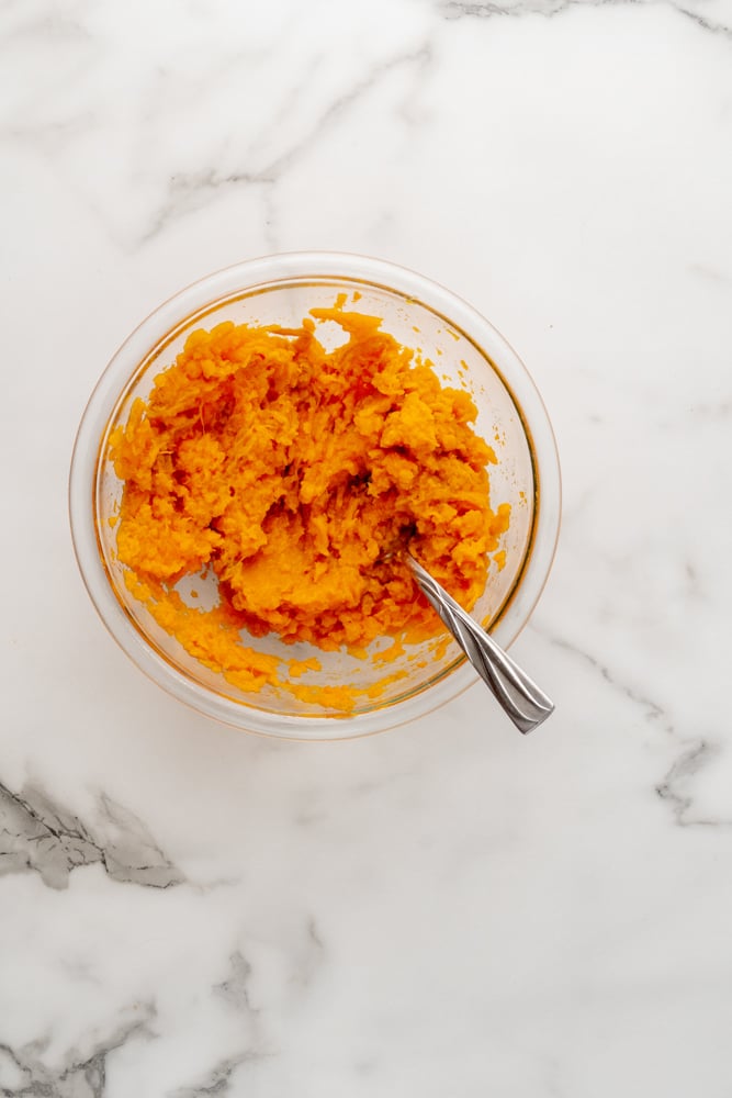 measured out mashed sweet potato in a small clear glass bowl