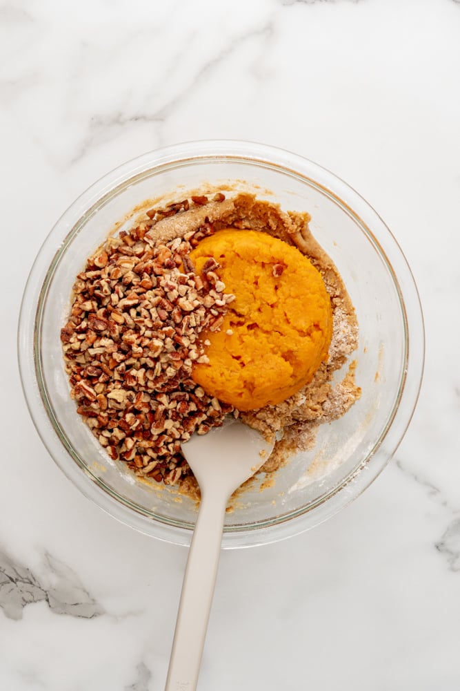 sweet potato and chopped pecans on top of flour mixture before mixing