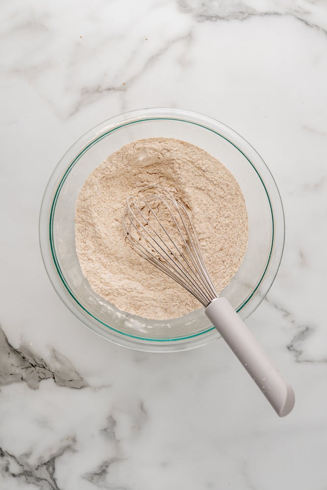 spices and flour in a clear glass bowl after mixing