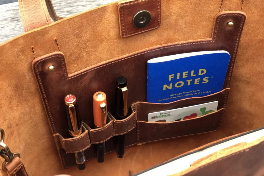 Inside a Galen Leather bag showing pen and passport organization