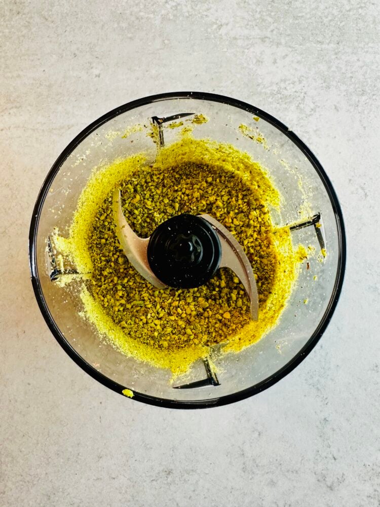 Ground pistachios in a food processor.