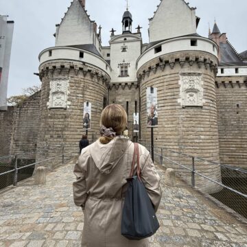 Rachelle standing in front of the castle of Brittany in Nantes