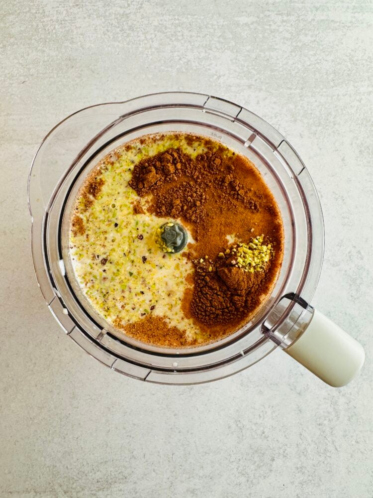 ingredients to make Pistachio coquito in a blender before blending
