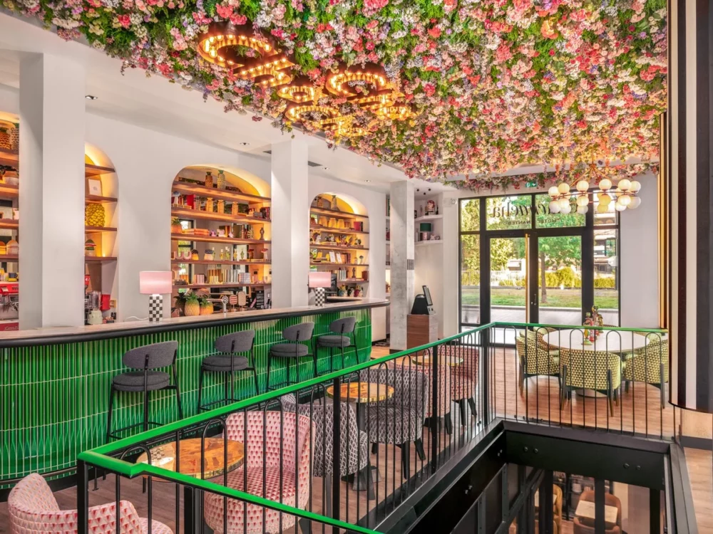 Colorful lobby and green counter space at the Chachacha hotel in Nantes.