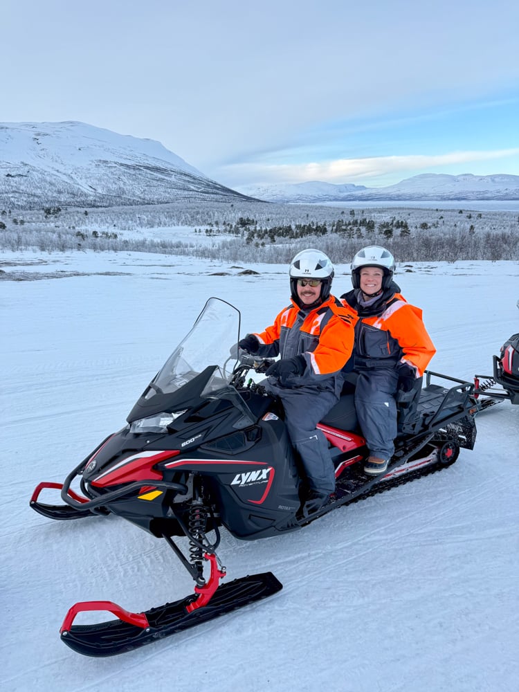 Pete and Rachelle on a snowmobile