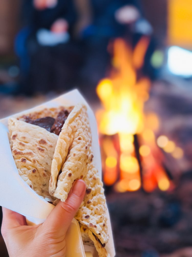 Pita sandwich by a fire