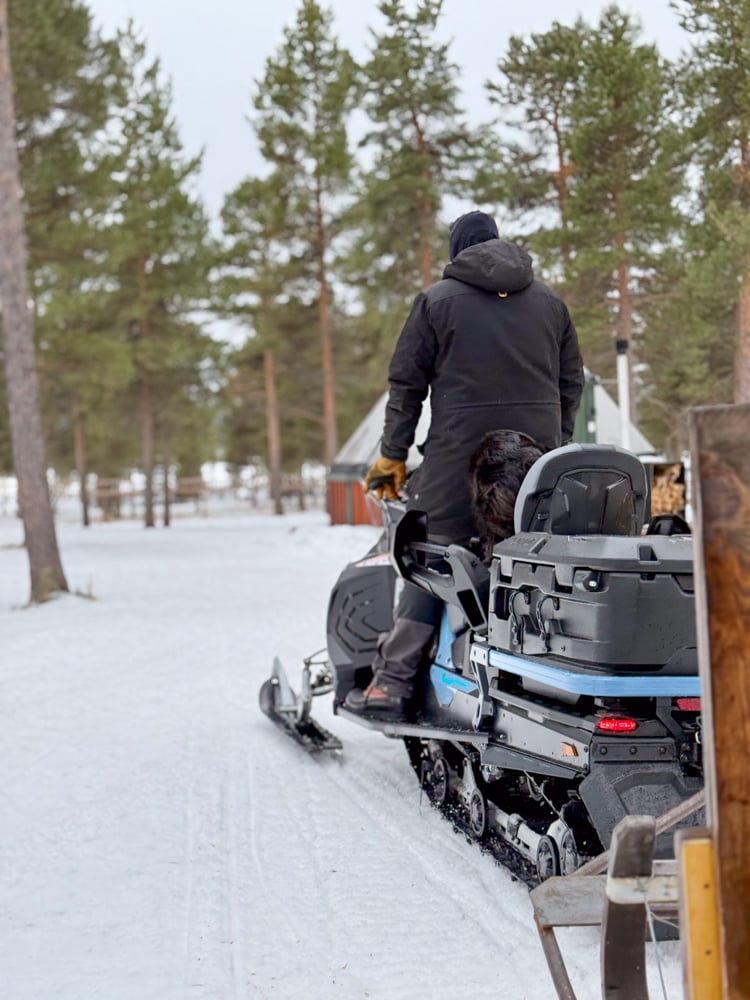 Corey on a snowmobile