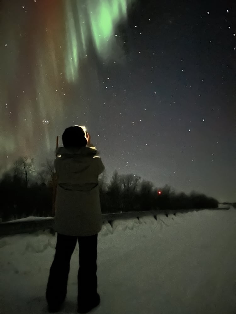 Pete looking up at the northern lights