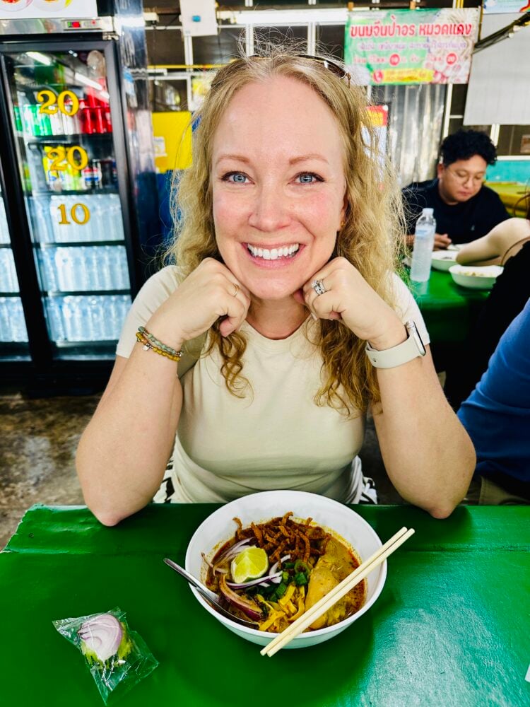 Rachelle with bowl of Thai curry noodles