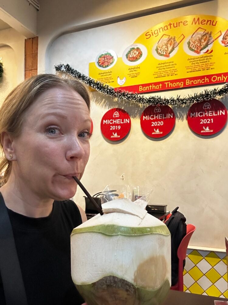 Rachelle sipping out of a coconut