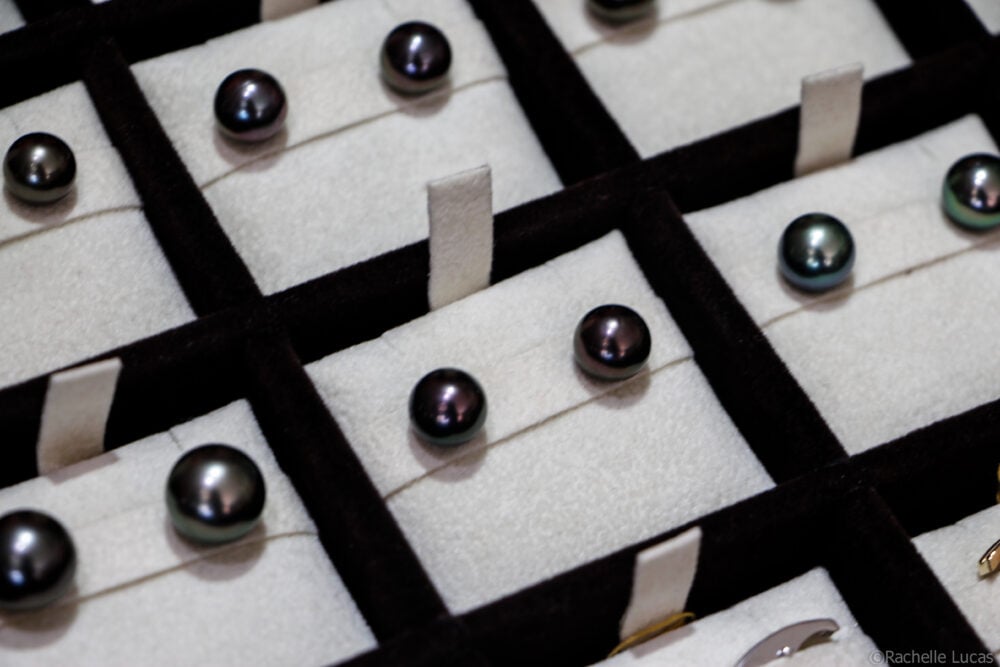 a tray of black pearl earrings in various shades and sizes