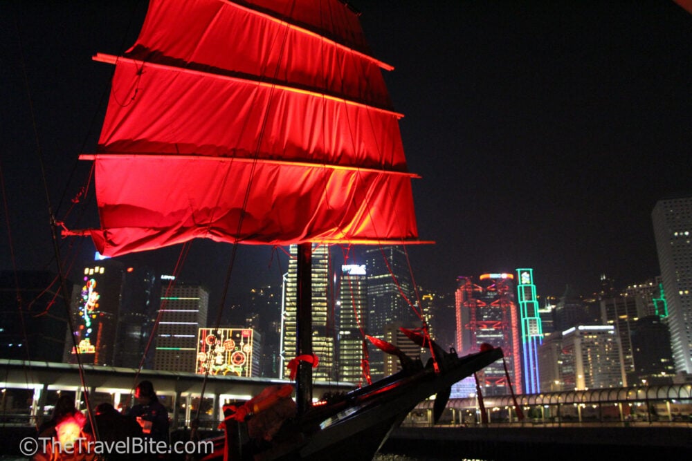 Aqua Luna junk boat with red sail in Victoria Harbour