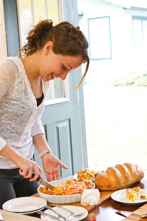 Rachelle slicing into Italian breakfast strata