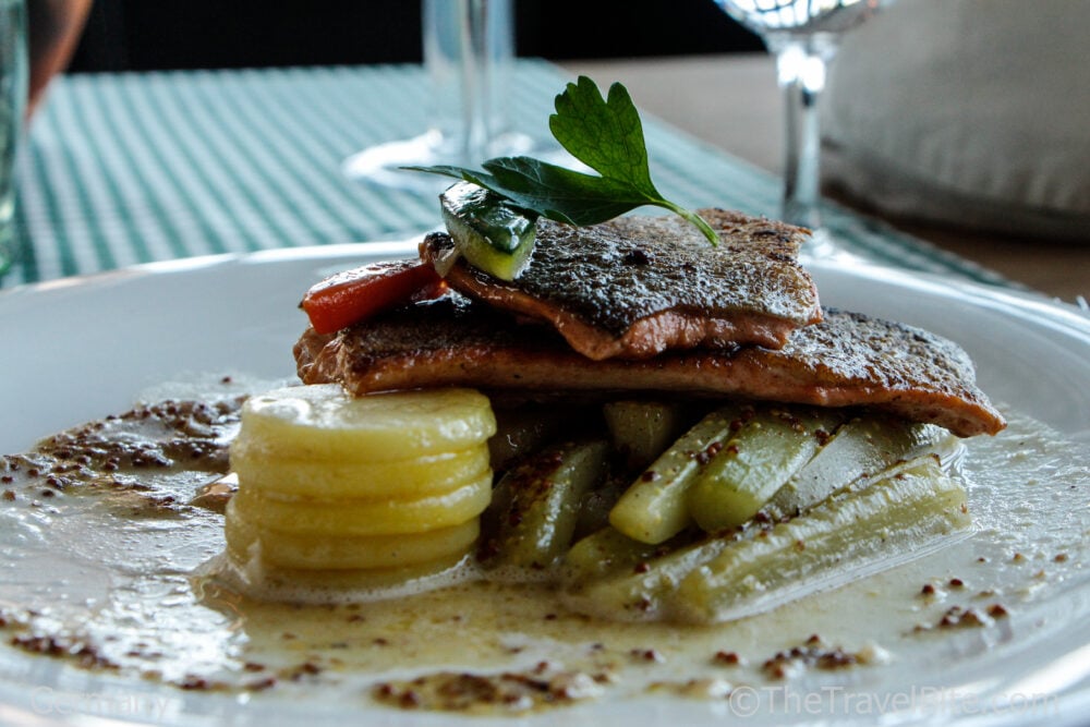 Stacked potatoes and fish 
