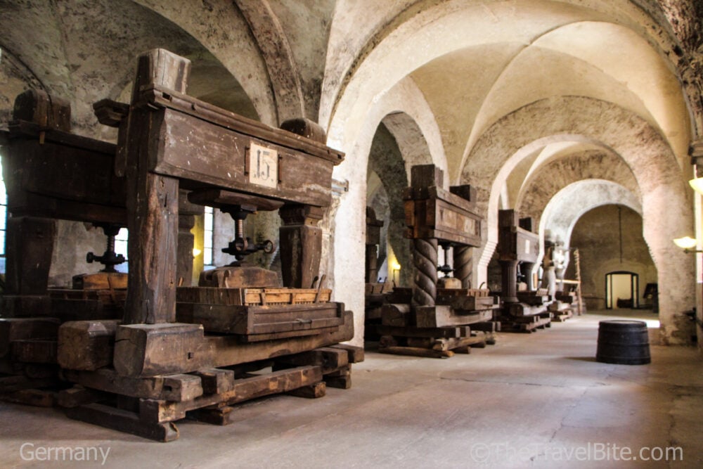 Hall filled wth historic wooden wine presses.