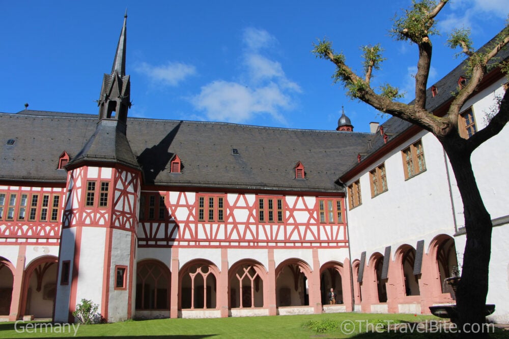 Kloster Eberbach courtyard showing the red timbered architecture and porticoes