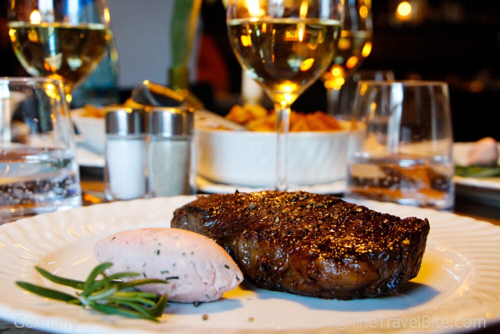 Steak and butter on a white plate