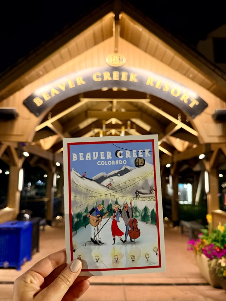 beaver creek Colorado postcard held under the Beaver Creek resort sign