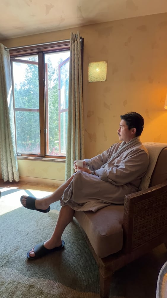 Pete relaxin holding tea at the spa