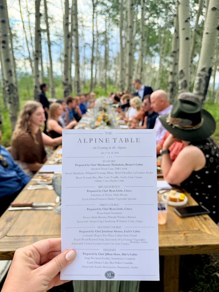 The Alpine Table menu held in front of the table